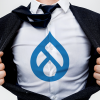 Man wearing a suit, repping Drupal